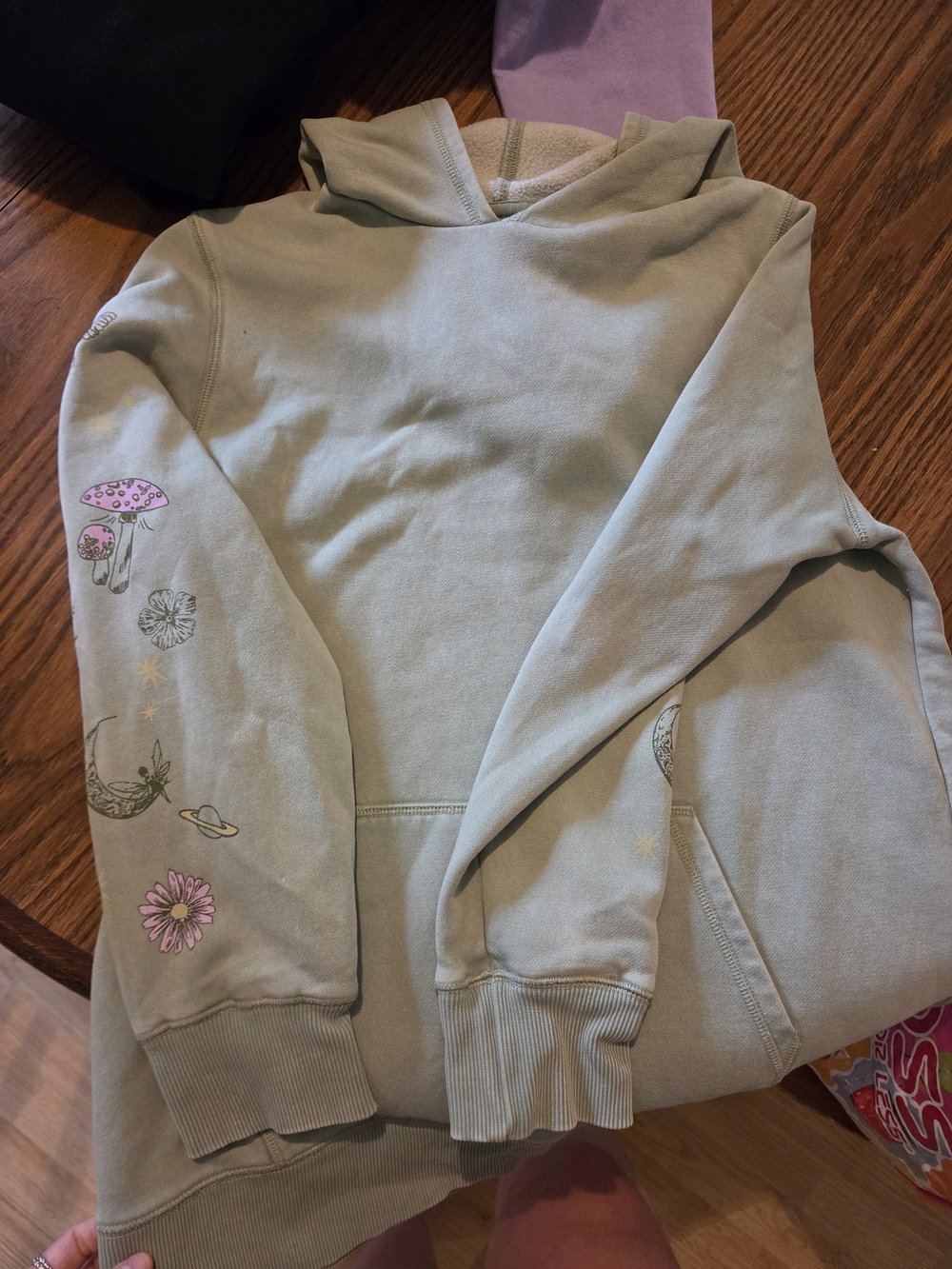 Muted Sage Graphic Hoodie with Floral and Celestial Sleeve Art